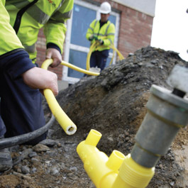 Workers connecting gas supply